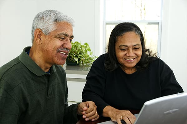 Senior couple looking at computer